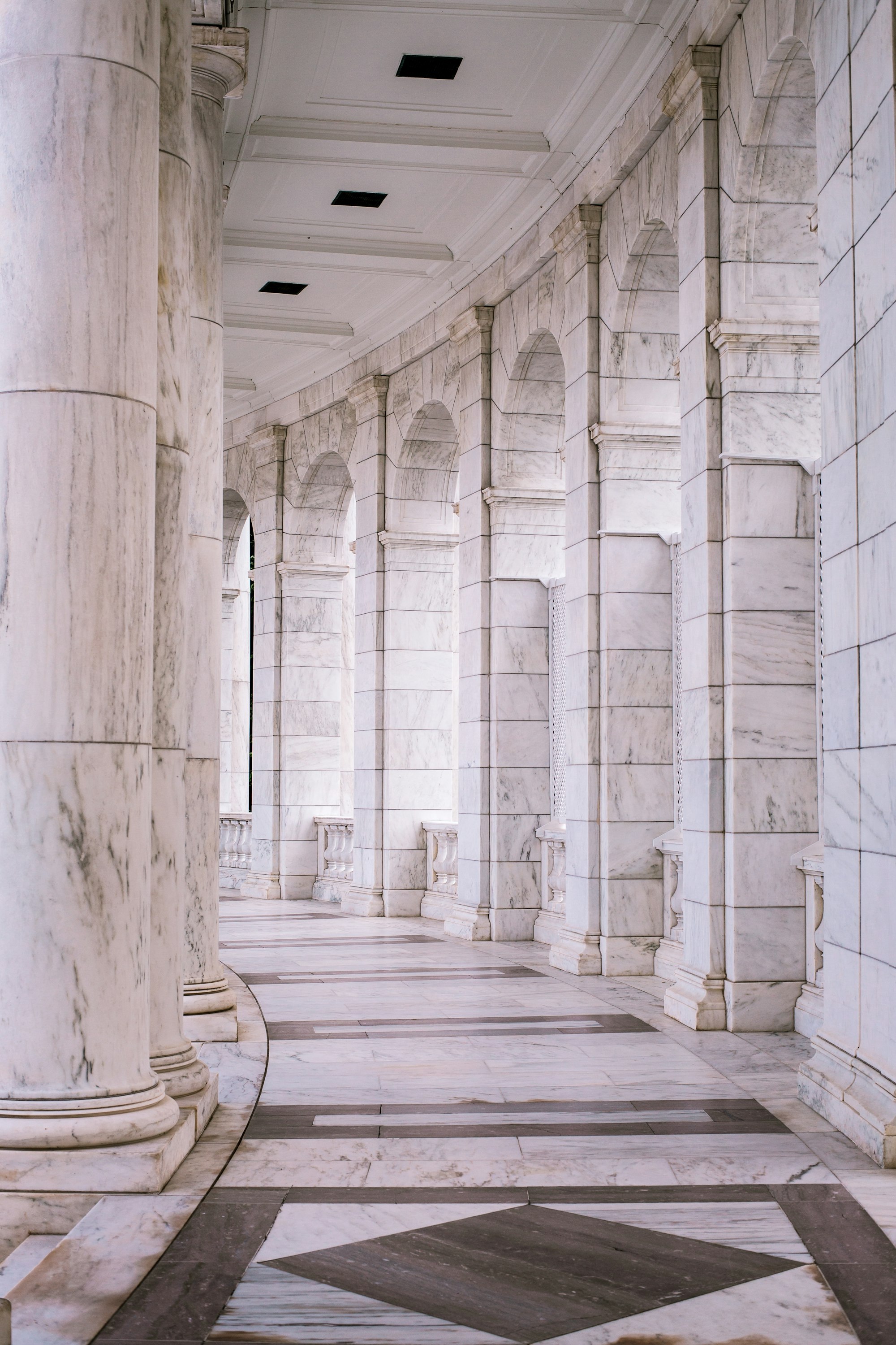 A classical marble colonnade — permanence, judgment and order.
